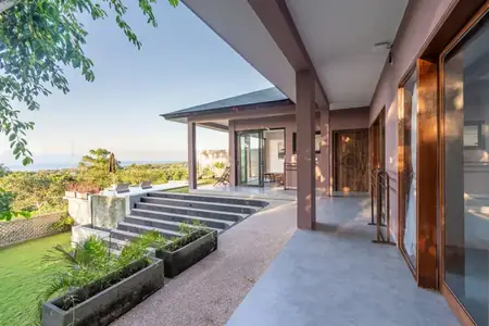 Casa Om veranda overlooking the garden and the sea