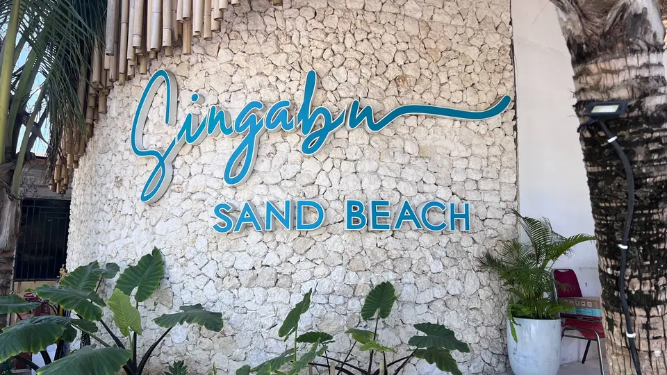Singabu Sand Beach sign at the entrance