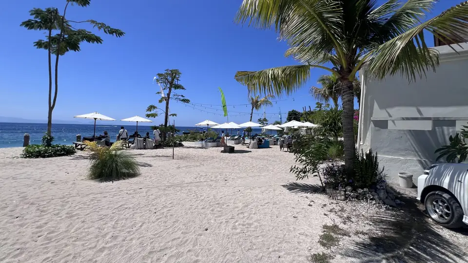 Beach sunbeds and parasols at Kharmara Beach Club