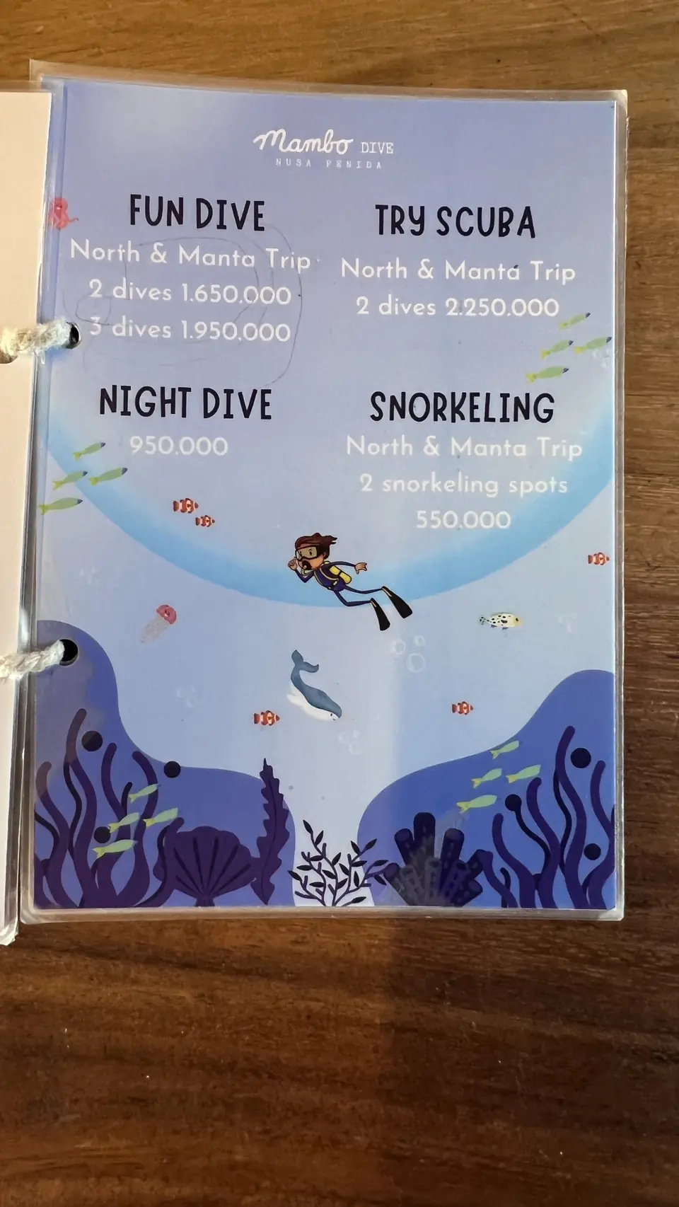 Mambo dive centre board listing fun dives, night dives and snorkelling
