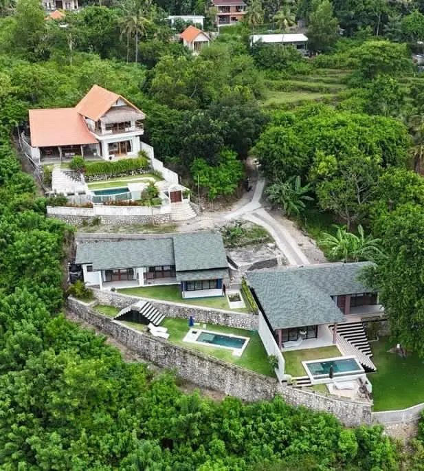 Aerial view of the three Treetop Heights villas in Ped, Nusa Penida