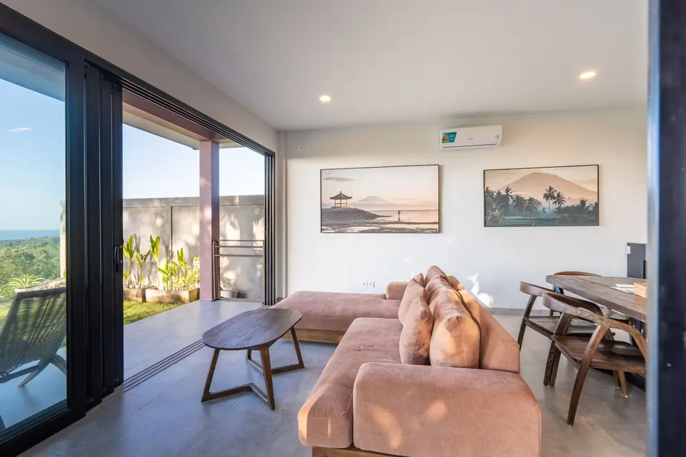 Casa Om open living and dining space with garden views